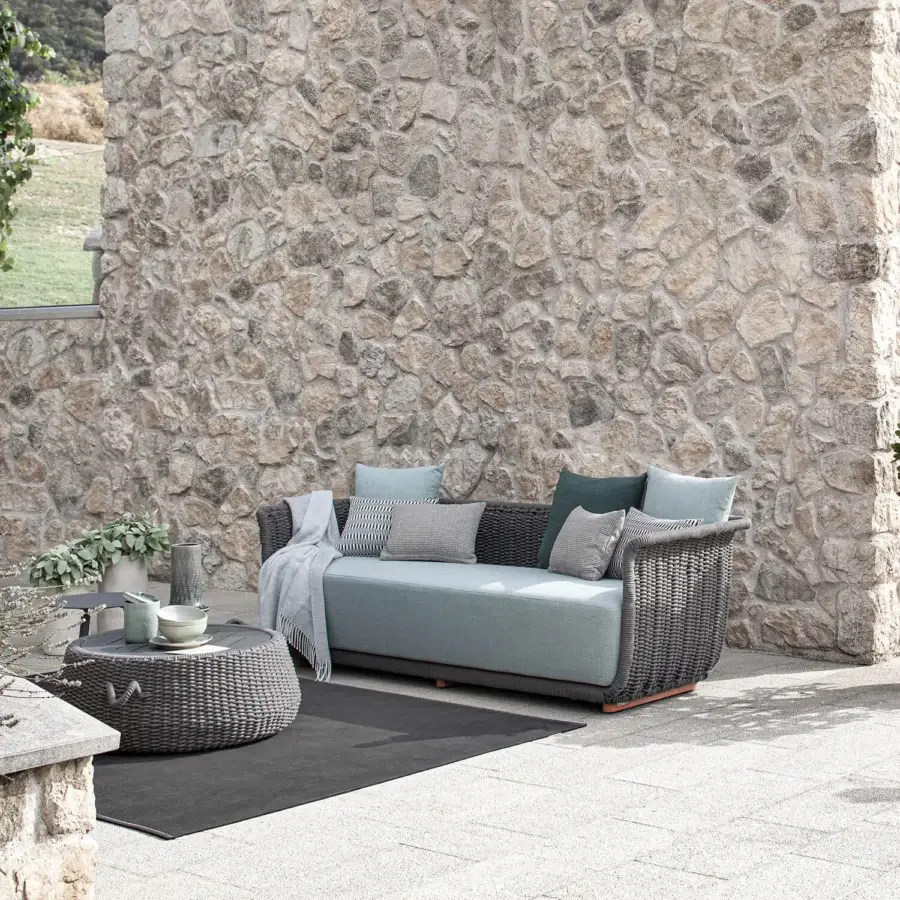 Exceptional Atmosphera Bellagio sofa woven with muted blue-grey melange acrylic yarn, exhibiting an open, tactile design with hand-woven rope detailing