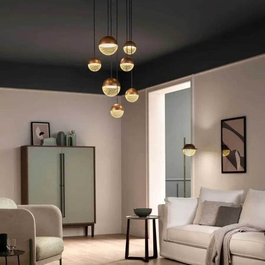 Distinguished Masiero Iglù suspension lamp with brushed patina metal and refined matt gold mesh diffusers suspended from warm wood