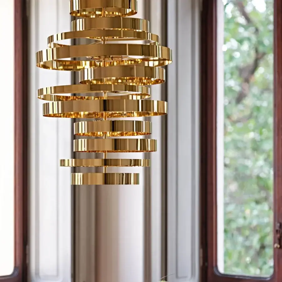 Distinguished Black Tie Olimpia suspension lamp crafted in polished stainless steel with a radiant golden finish