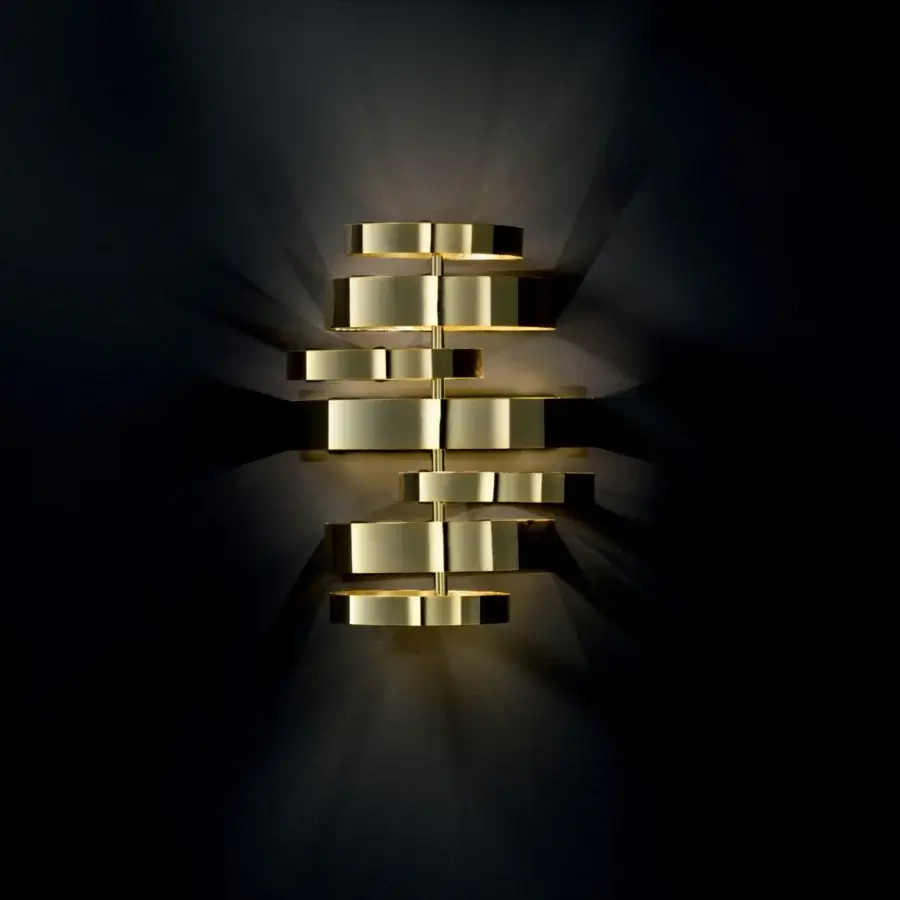 Superior Black Tie Olly wall lamp crafted in stainless steel with asymmetrical stacked rectangular elements and a polished golden yellow tone