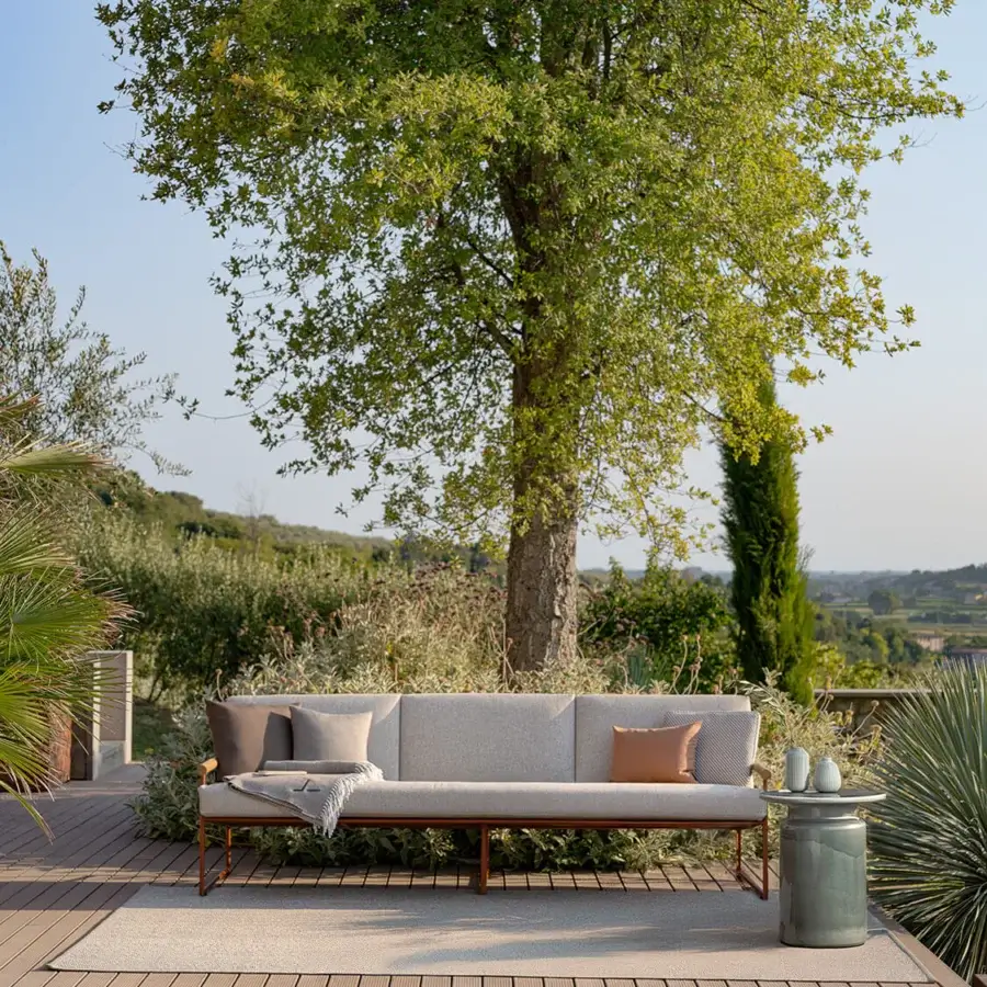 Exceptional Atmosphera Pipe sofa with warm terracotta epoxy-coated steel and hand-woven light grey acrylic cord backrest crafted with teak armrests