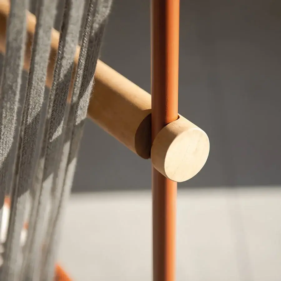 Exceptional Atmosphera Pipe armchair with terracotta epoxy-coated steel, cylindrical teak armrests and hand-woven acrylic cords