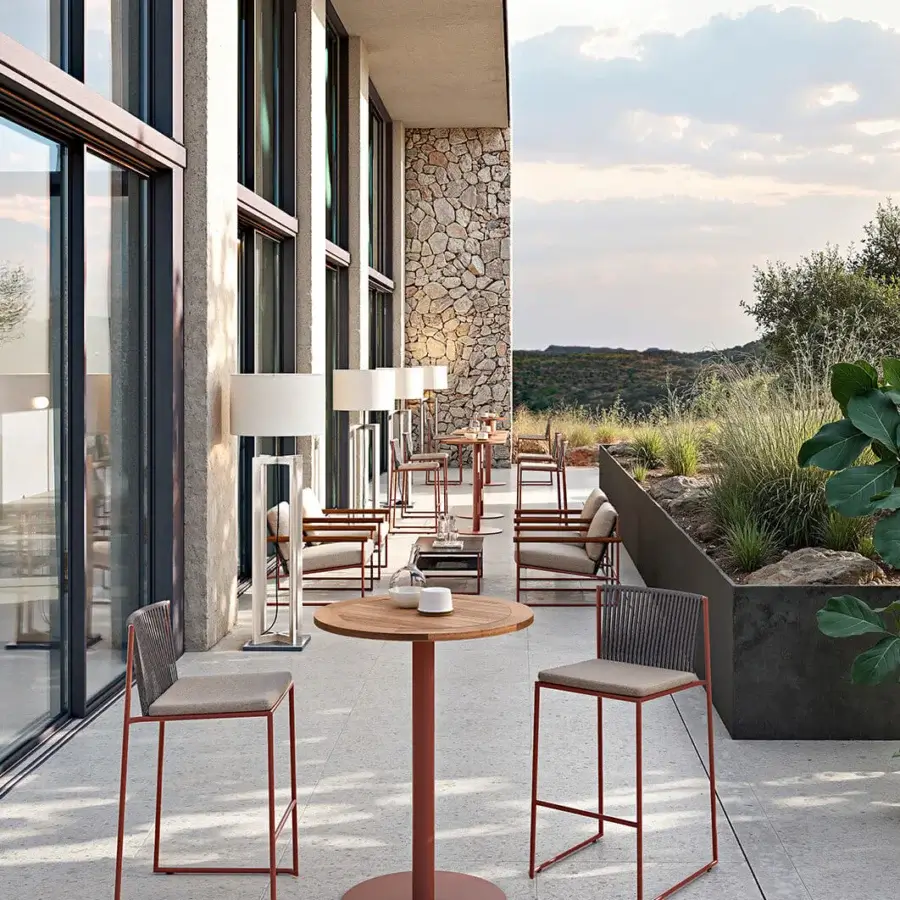Sophisticated Atmosphera Pipe stool with terracotta epoxy powder-coated steel and cool grey hand-woven acrylic rope seat