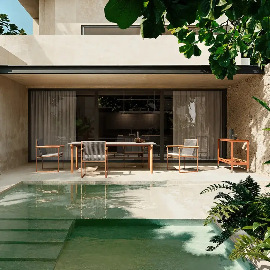 Distinguished Atmosphera Pipe table with a muted bronze gres top and robust solid Asian teak frame