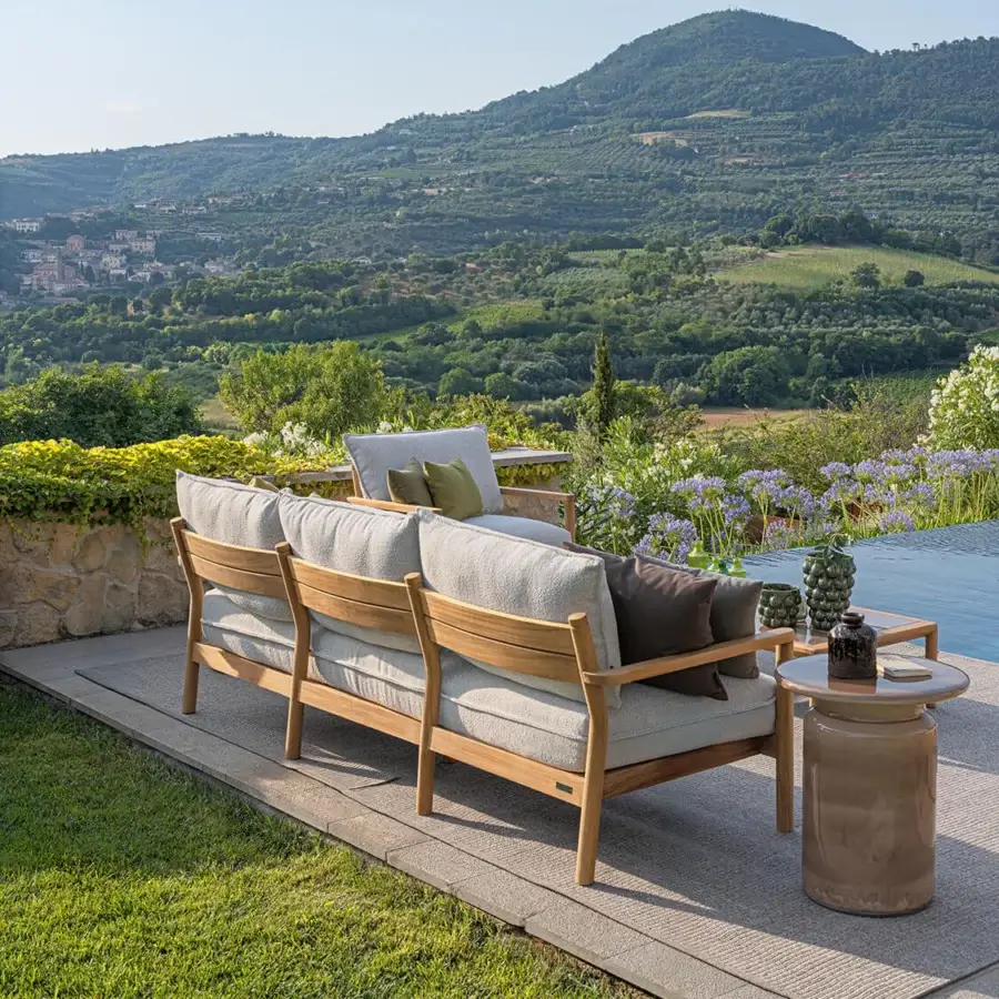 Sophisticated Atmosphera Panama sofa with substantial solid teak frame and inviting neutral gray with muted olive green cushions