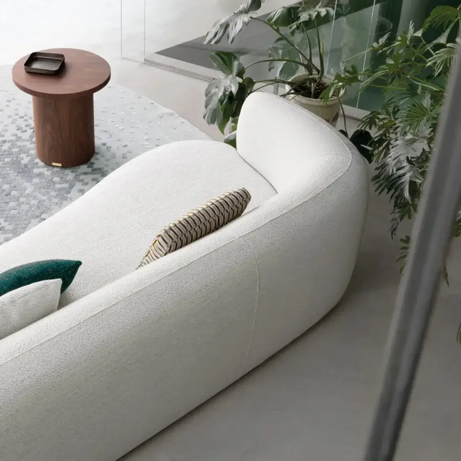 Distinguished Capital Icaro side table built in wood with a smooth satin finish exhibiting a rounded form