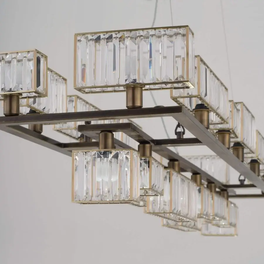 Superior Patrizia Garganti Tur chandelier crafted in metallic structure with transparent crystal lozenges and muted gold finish