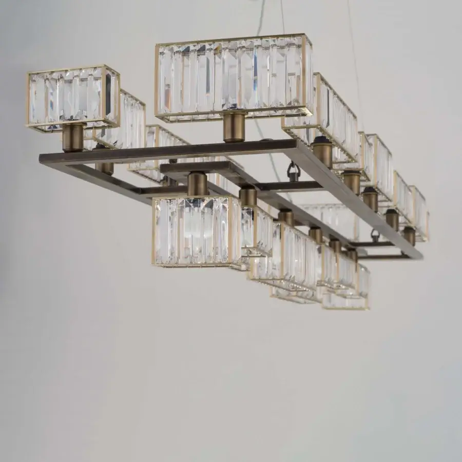 Exceptional Patrizia Garganti Tur chandelier crafted in Italy with transparent crystal lozenges and textured antique brass metallic structure