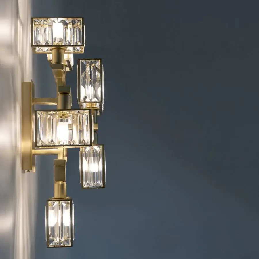Superior Patrizia Garganti Tur wall lamp crafted in satin brass-toned metal with clear crystal elements for diffused illumination