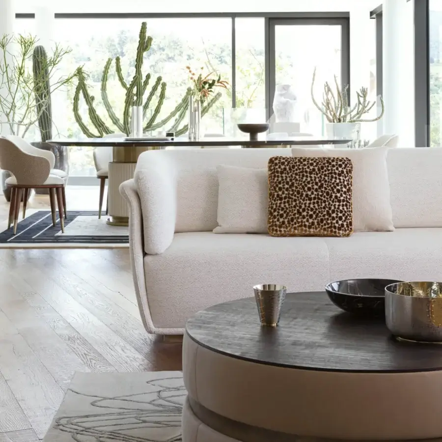 Distinguished Capital Cookie Coffee Table with a dark brown textured wood tabletop and upholstered base showcasing Italian craftsmanship