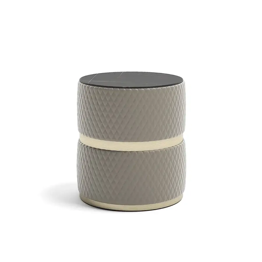 Captivating Capital Cookie side table with quilted gray-taupe textile upholstery and dark marble tabletop encircled by light-toned wood