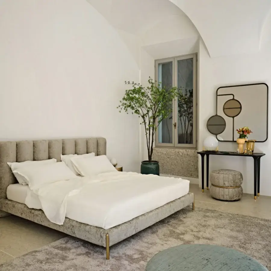 Elegant Black Tie Ibisco bed with sculpted headboard crafted from poplar wood and muted gray-taupe textile upholstery with gold-toned metal legs