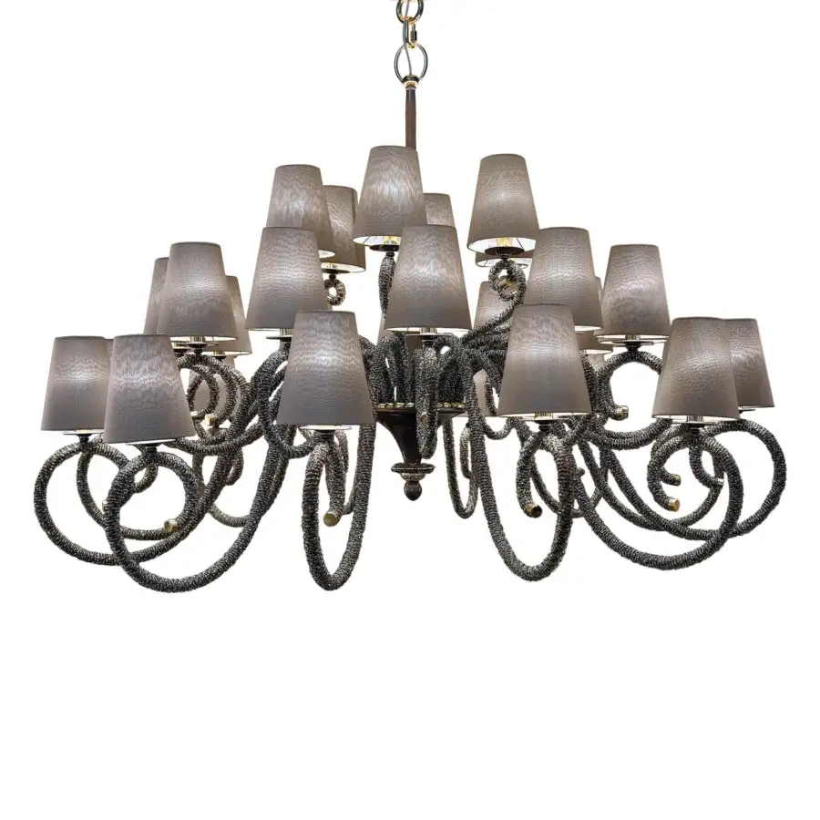 Distinguished Patrizia Garganti 1180 chandelier enveloping a metal structure in crystal with warm brass accents and muted gray finish
