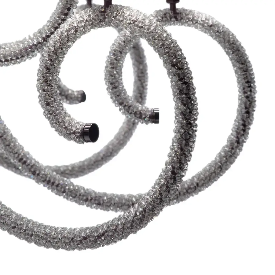 Alluring Patrizia Garganti 1180 chandelier exhibiting interconnected circular form with crystal and silvery-gray finish