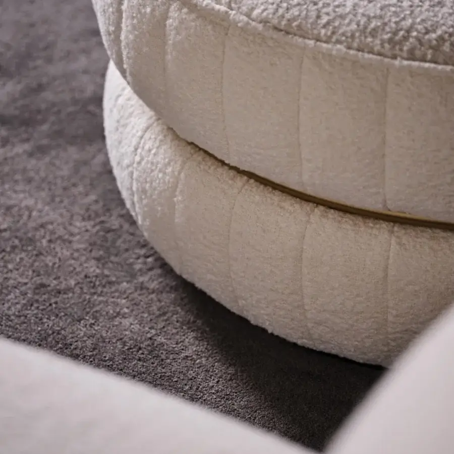 Distinguished Black Tie Lillo ottoman with creamy off-white textile upholstery and slender metal ring accent