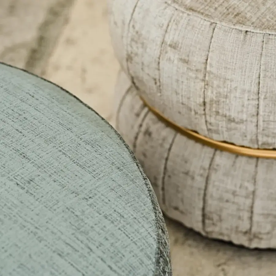 Elegant Black Tie Lillo ottoman with teal-blue textured textile upholstery and gilded metal framing