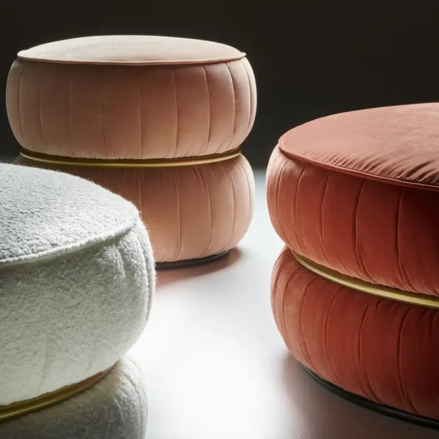 Distinctive Black Tie Lillo ottoman with plush coral textile upholstery and slender gold-toned metal ring
