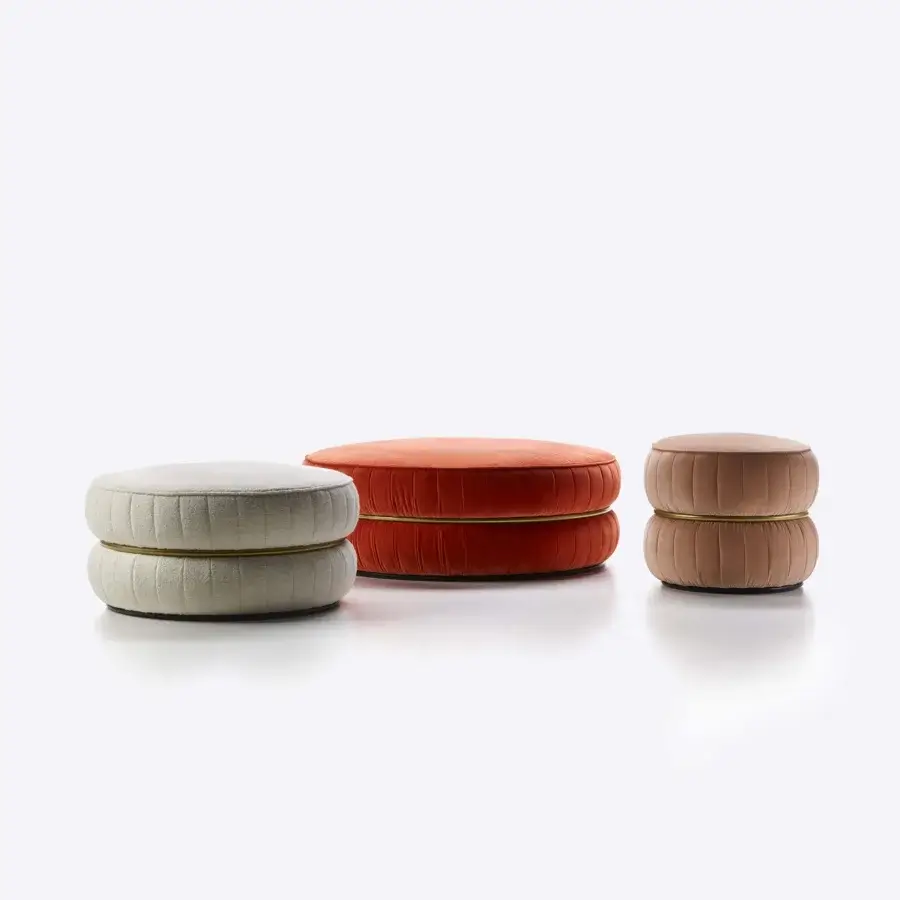 Distinguished Black Tie Lillo ottoman with terracotta orange textile upholstery, exhibiting refined ribbed stitching and slender metal detail