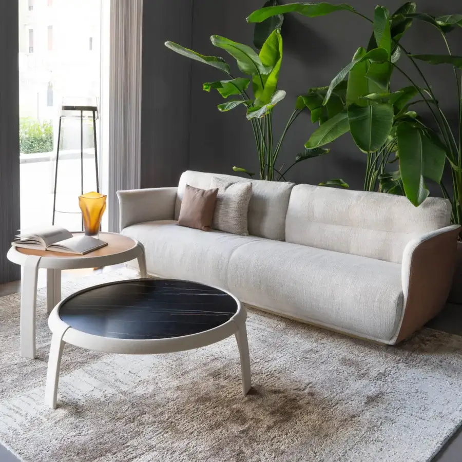 Distinguished Capital Omega coffee table with round marble tabletop and leather-clad structure in metallic finish