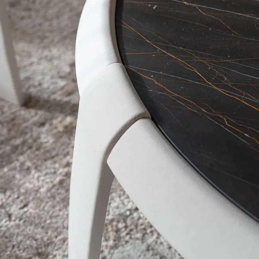 Exceptional Capital Omega coffee table with marble tabletop exhibiting golden veining and smoothly finished light-colored leather base