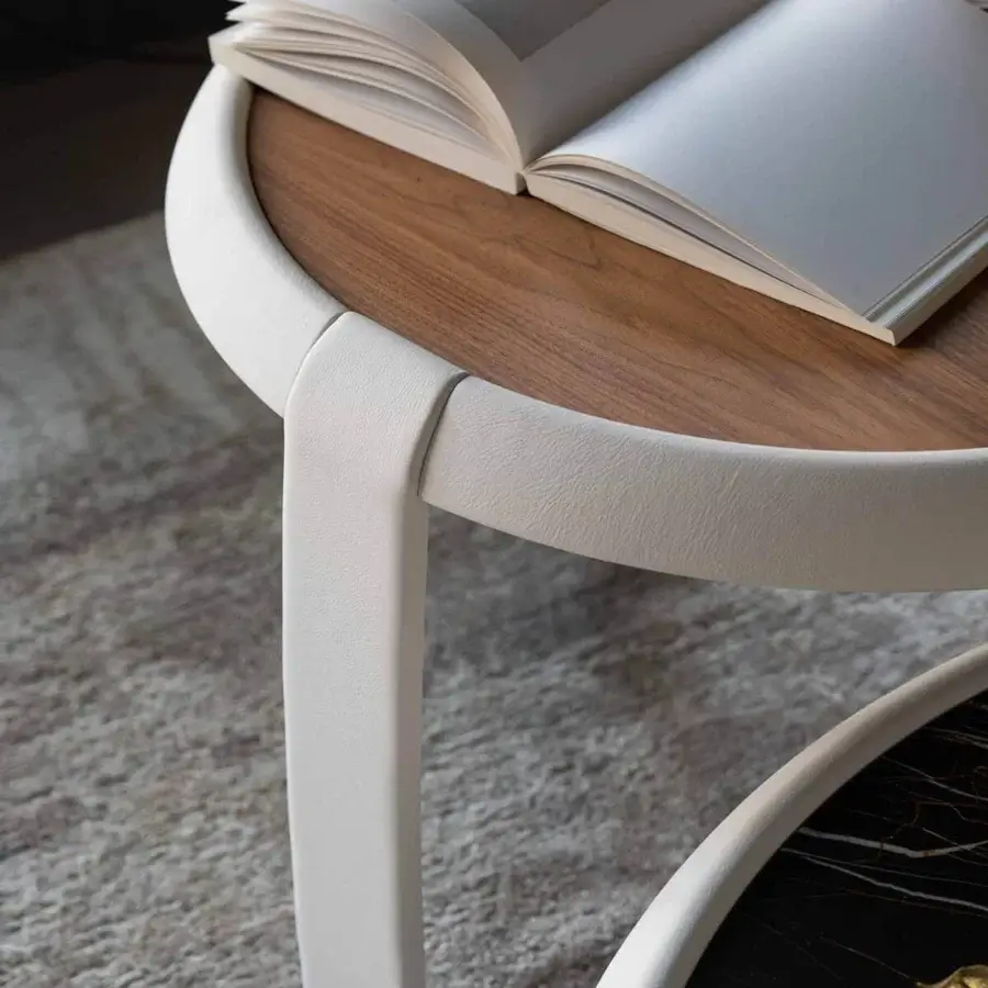 Distinctive Capital Omega side table with round wood tabletop and sleek white base crafted with elegant metallic finish details