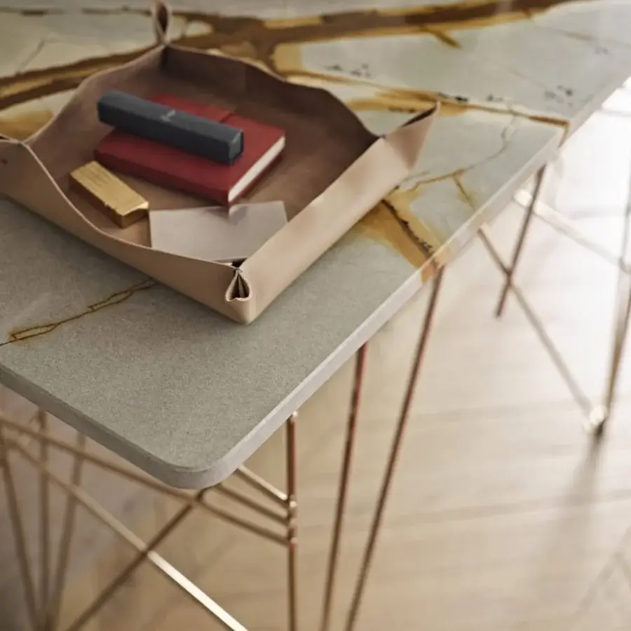Exceptional Black Tie Lin console with quartzite tabletop exhibiting gold veining and reflective finish supported by rose-gold toned steel legs