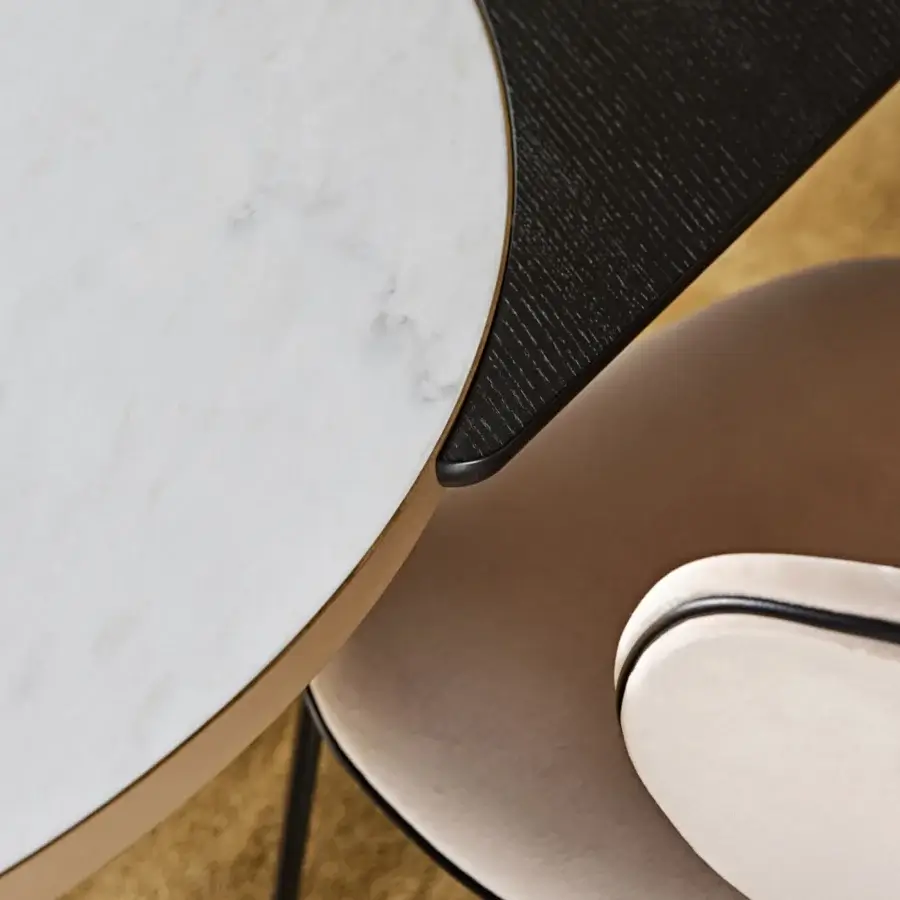 Distinguished Black Tie Opera table with polished marble and delicate metal, exhibiting a contemporary rounded silhouette