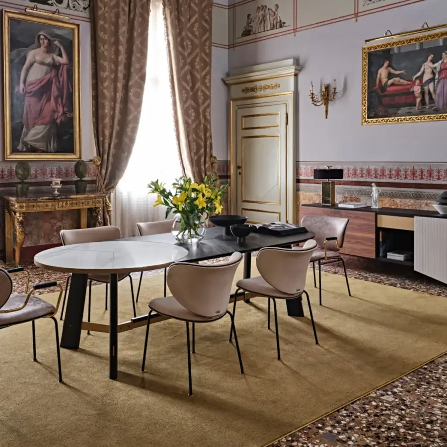 Distinguished Black Tie Opera table with dark-toned wood and angular metal, exhibiting a satin finish and organic oval silhouette