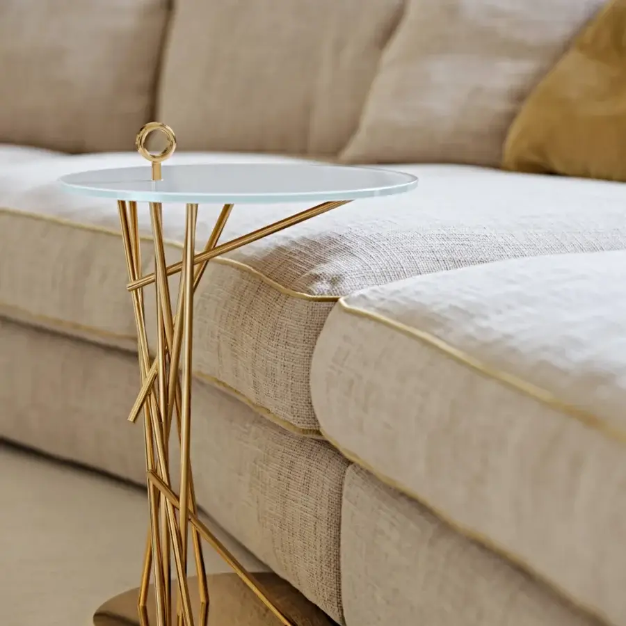 Exceptional Black Tie Tao side table with clear glass top and sculptural golden stainless steel base in glossy finish