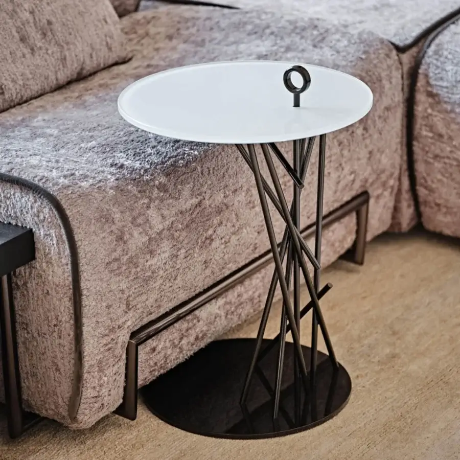 Elegant Black Tie Tao side table with sleek glass top and sculptural stainless steel base in dark matte finish