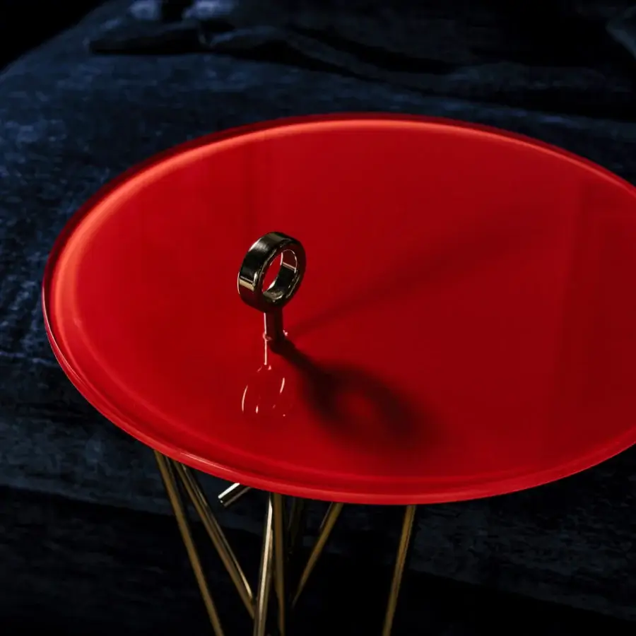 Distinguished Black Tie Tao side table with red glass top and slender gold-toned stainless steel legs crafted in Italy