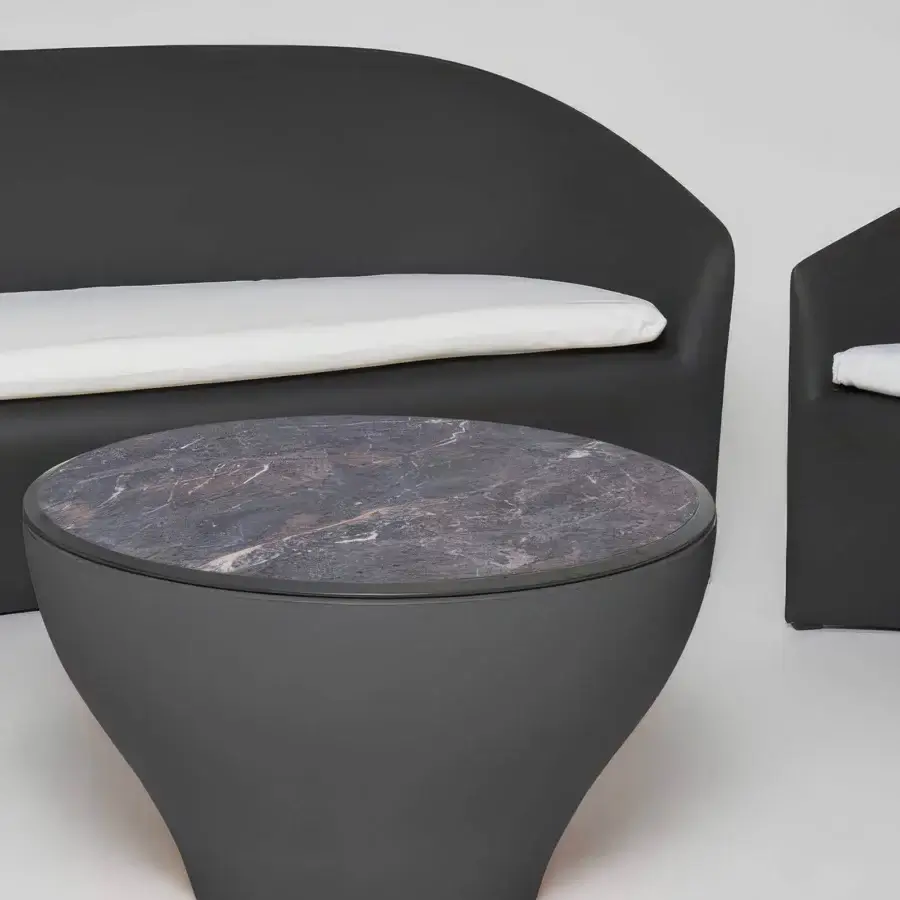 Elegant Serralunga Drum coffee table crafted in dark gray recyclable LLDPE with a Black Marble high-pressure laminate tabletop
