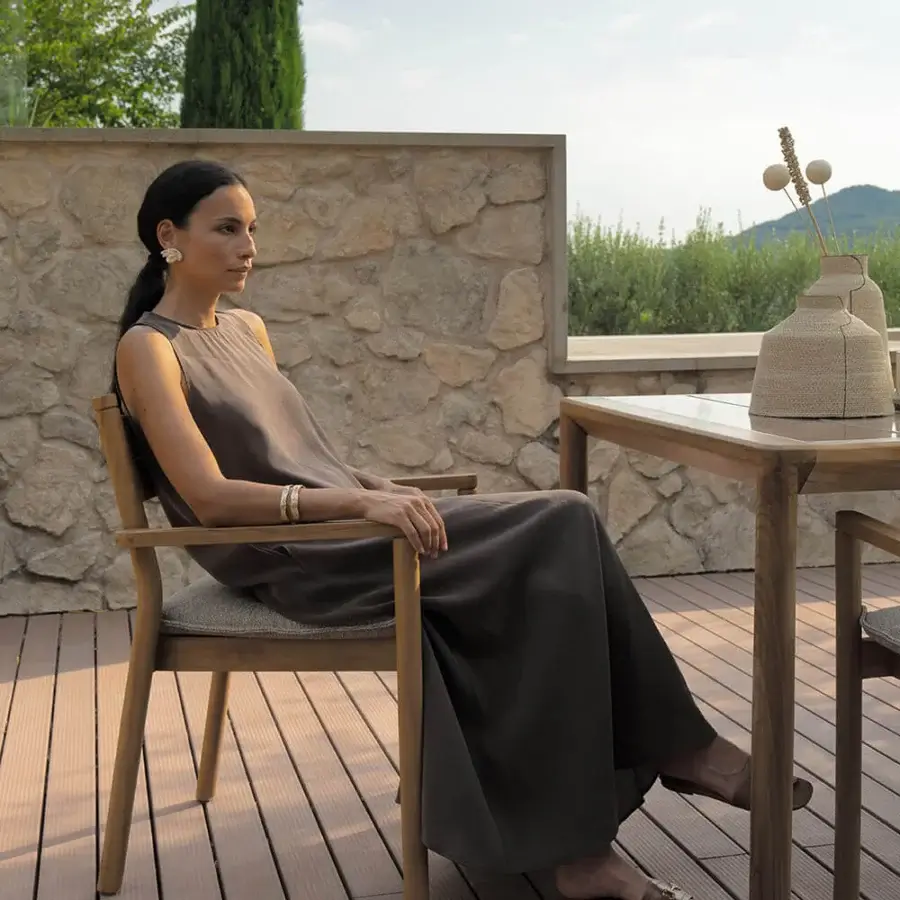 Distinguished Atmosphera Panama armchair with sculptural form and muted olive-green textile cushion in medium-toned brown timber construction