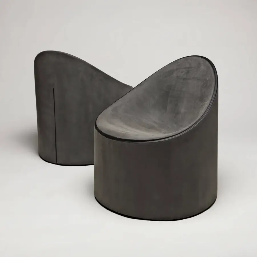 Sophisticated Serralunga Bay Lounge chair in dark gray LLDPE plastic with a smooth Moleskin finish and enveloping form
