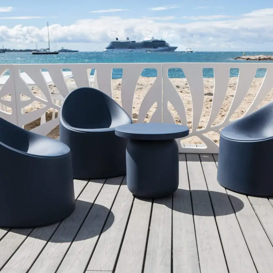 Exceptional Serralunga Bay Lounge chair in dark navy blue LLDPE with distinctive Moleskin finish offers balanced design and lasting comfort
