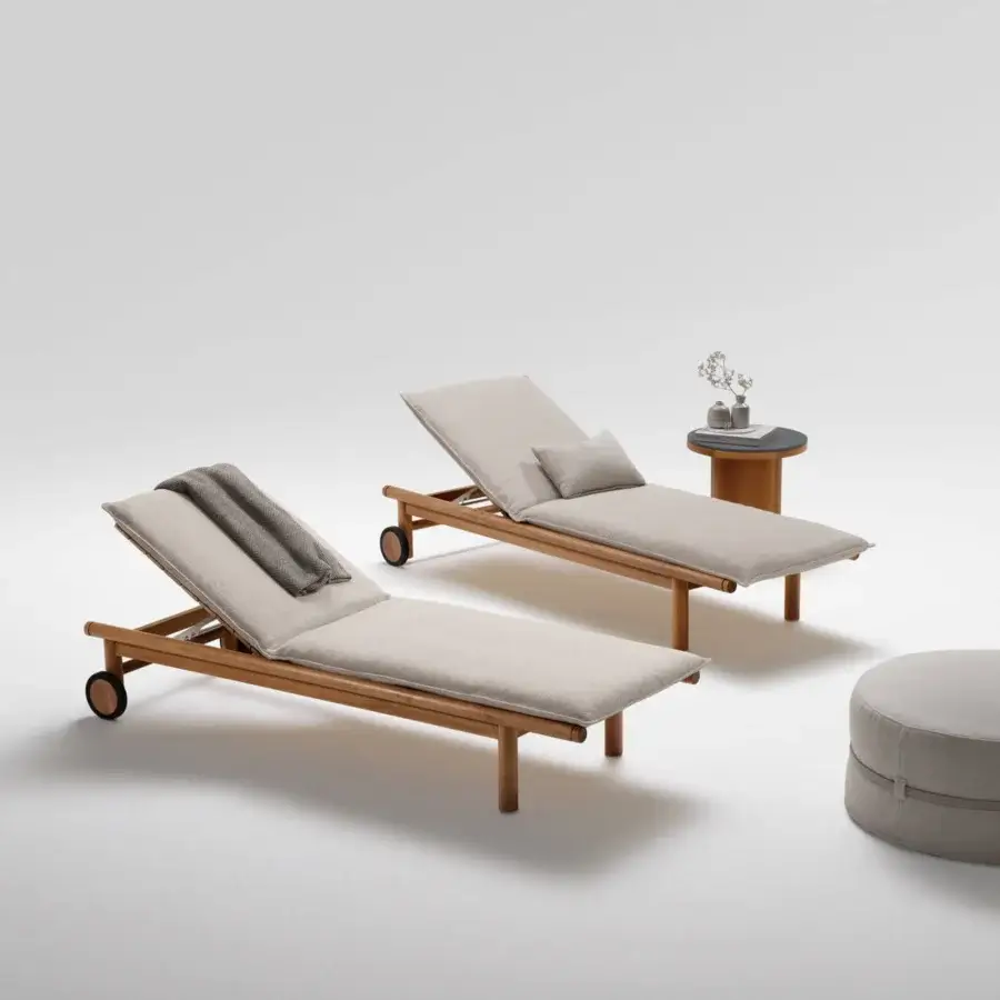 Exceptional Atmosphera Panama lounger built with light gray textile upholstery and a sculptural teak frame with grooved detail
