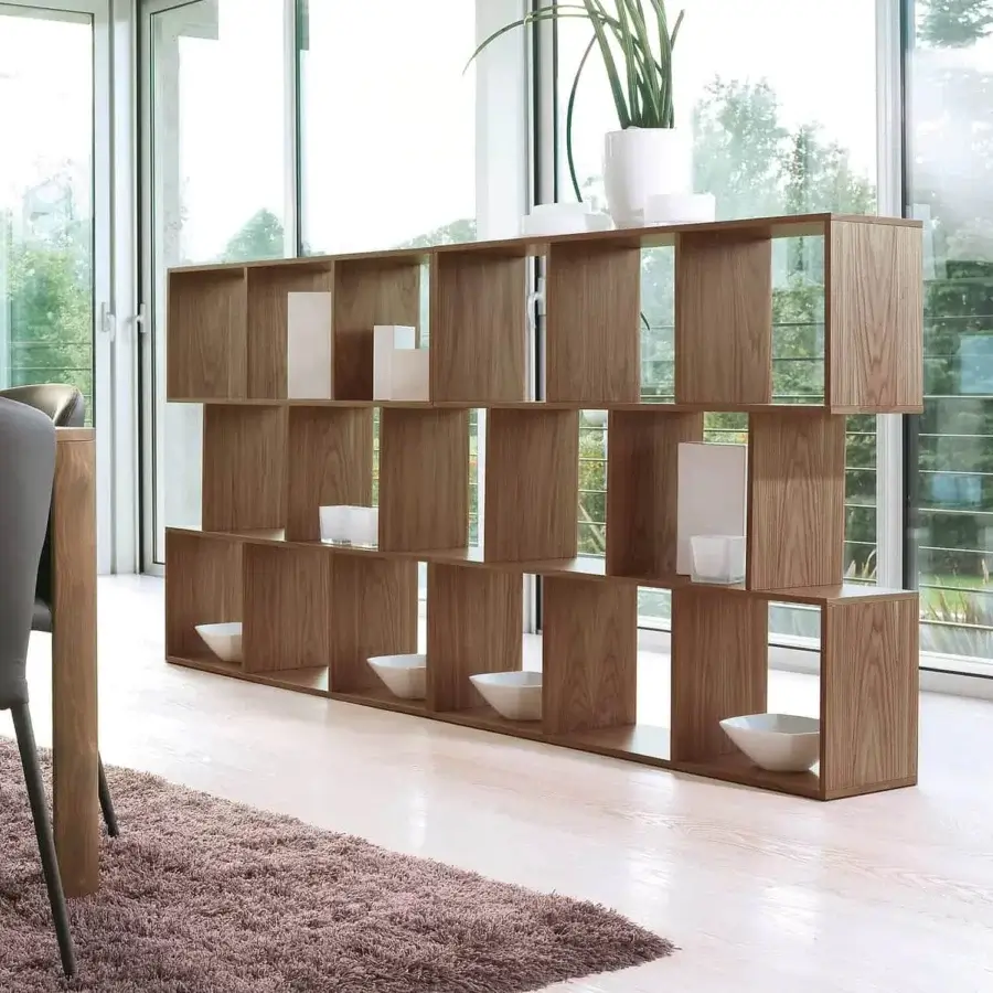 Elegant Ivano Antonello Italia bookcase with repeating modular openings in medium-toned brown wood and a satin finish