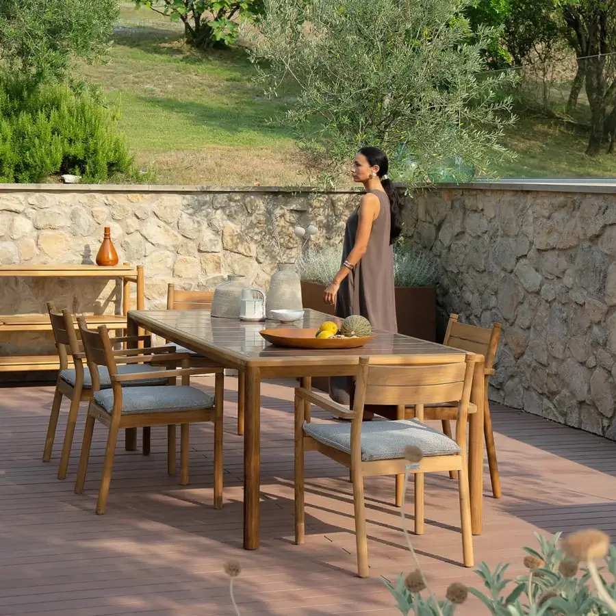 Distinguished Atmosphera Panama table crafted in medium-brown teak wood with a satin finish and durable ceramicized lava stone tabletop