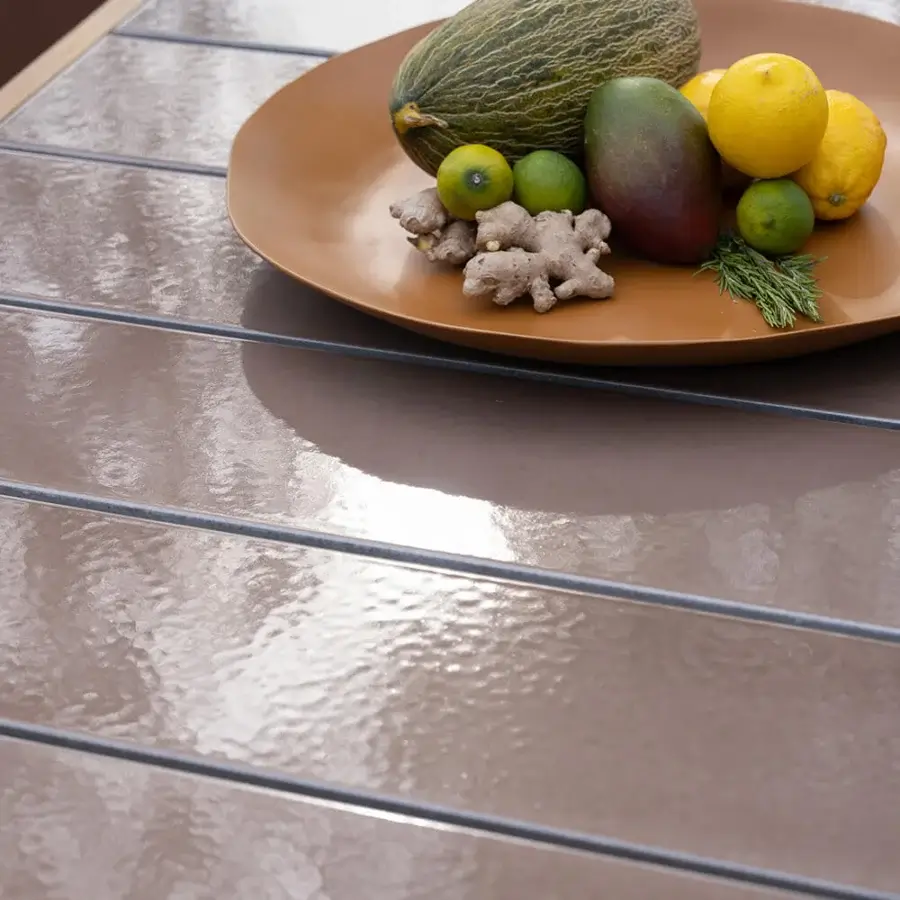 Distinguished Atmosphera Panama table crafted in teak with a glossy taupe ceramicized lava stone tabletop displaying a subtle linear pattern