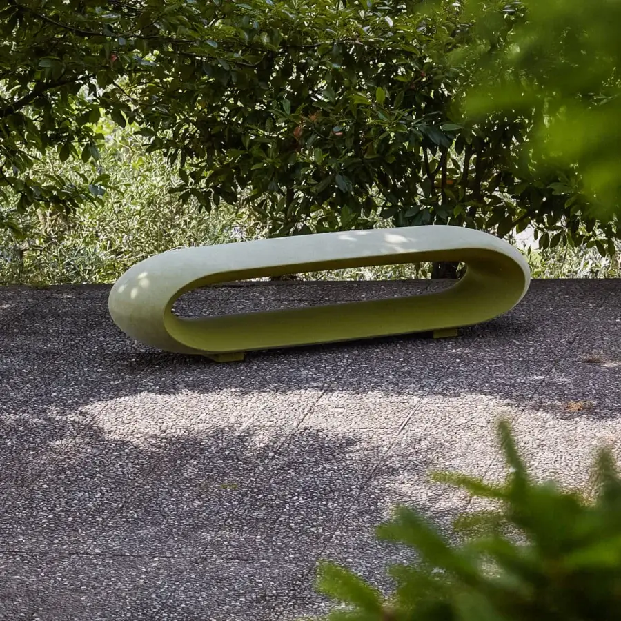 Distinguished Serralunga Loop Bench molded from durable LLDPE with a luxurious lacquered pale yellow-green finish offers a continuous form