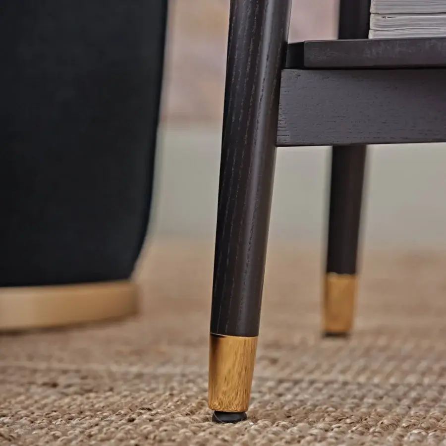 Distinguished Black Tie Alfio nightstand crafted in wood with dark satin finish and brass-toned feet caps