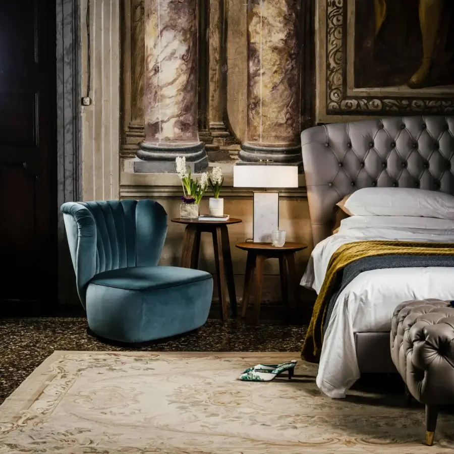 Superior Black Tie Amelia lounge chair with enveloping silhouette and muted teal-blue hand-stitched upholstery finish