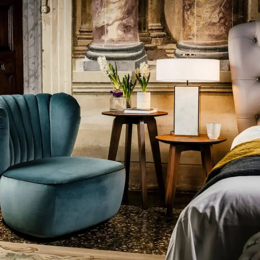 Distinguished Black Tie Amelia lounge chair with enveloping form upholstered in matte velvet and delicately pleated backrest