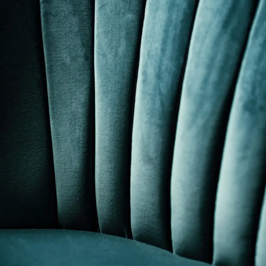 Exceptional Black Tie Amelia lounge chair with organically curved silhouette upholstered in deep teal velvet and matte finish