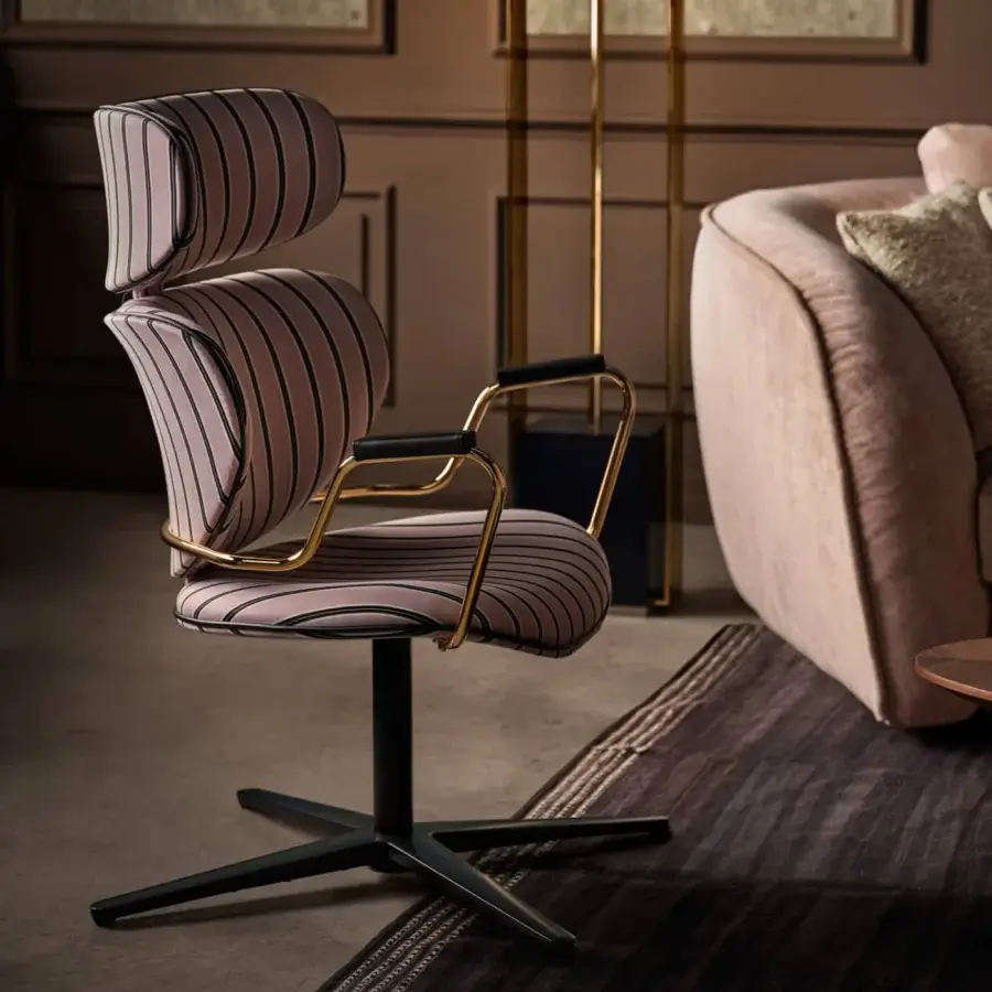 Stylish Black Tie Asia swivel lounge chair upholstered in pink and purple striped textile with polished golden metal armrests and dark metal base