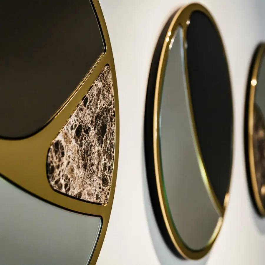 Exceptional Black Tie Delta mirrors crafted in Italy with Emperador marble and polished brass-toned metal framing geometric shapes