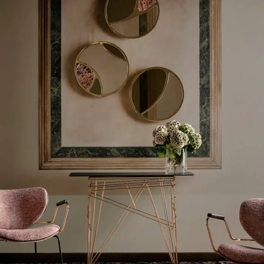 Elegant Black Tie Delta mirrors built with Emperador marble, polished gold-toned metal and mirrored surfaces crafted in Italy