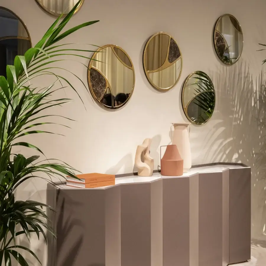 Distinguished Black Tie Delta mirrors crafted with Emperador marble and muted gold satin metal for a contemporary aesthetic