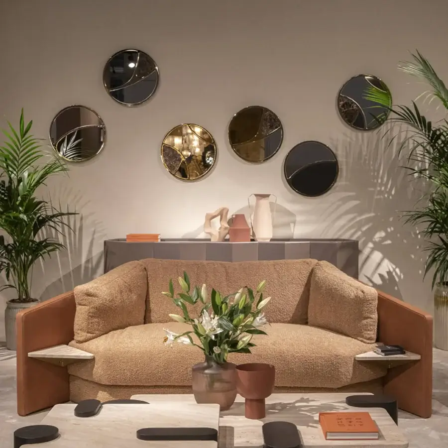 Exclusive Black Tie Delta mirrors crafted with mirrored glass and Emperador marble in matte black, bronze, and gold-toned metal finishes