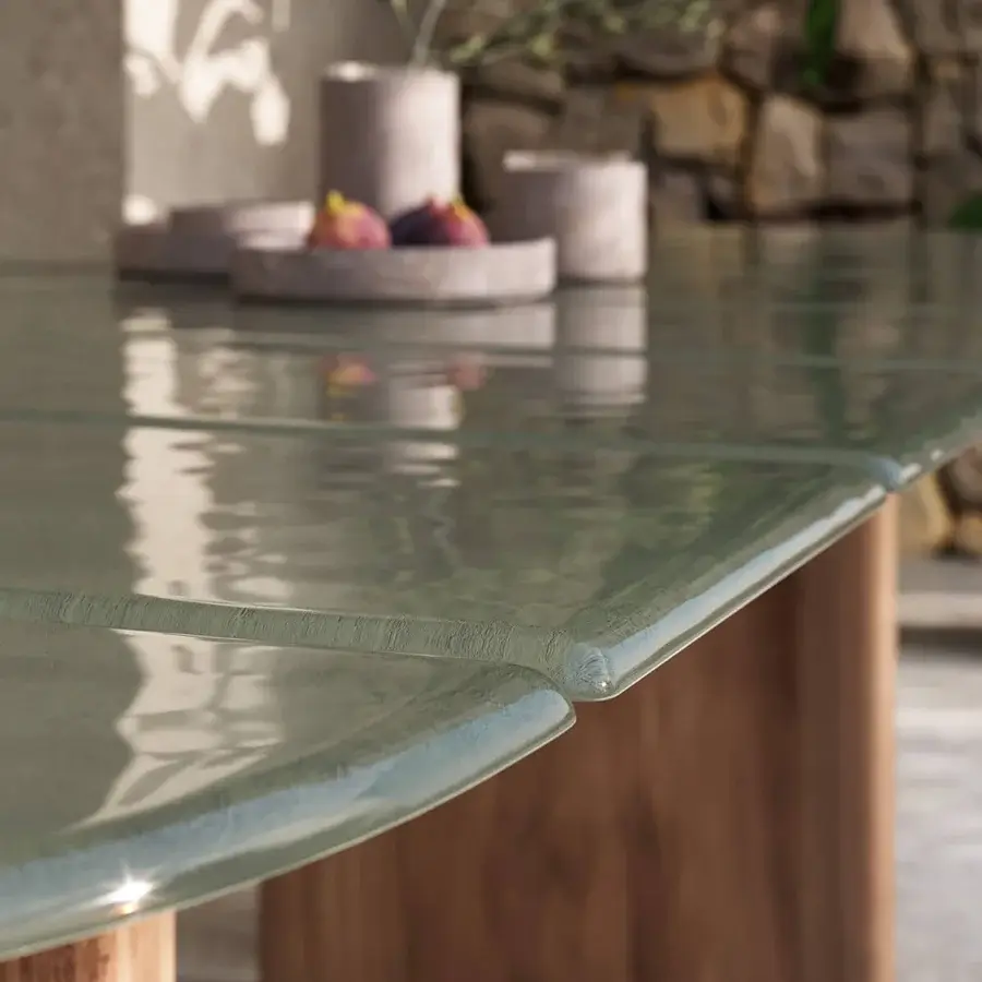 Innovative Atmosphera Materia table built with subtly textured glass and solid Asian Teak in a warm medium-brown finish